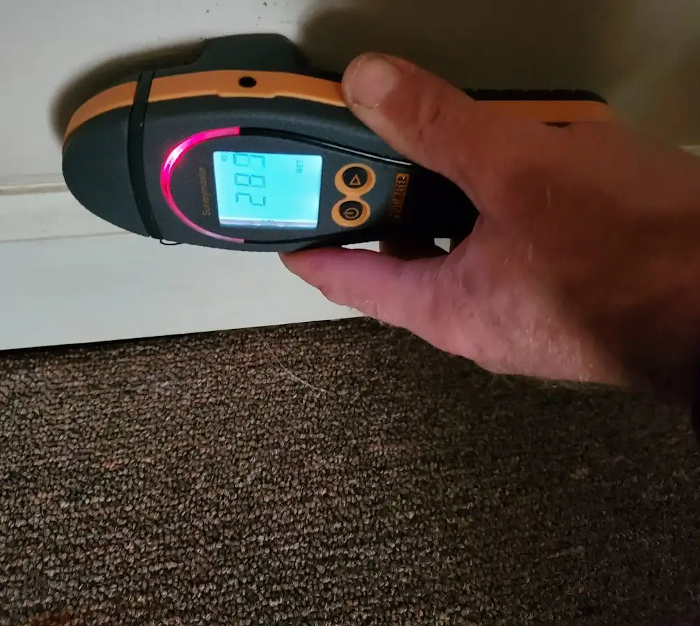 Moisture detection at baseboard during Storm Damage Restoration in Napili-Honokowai